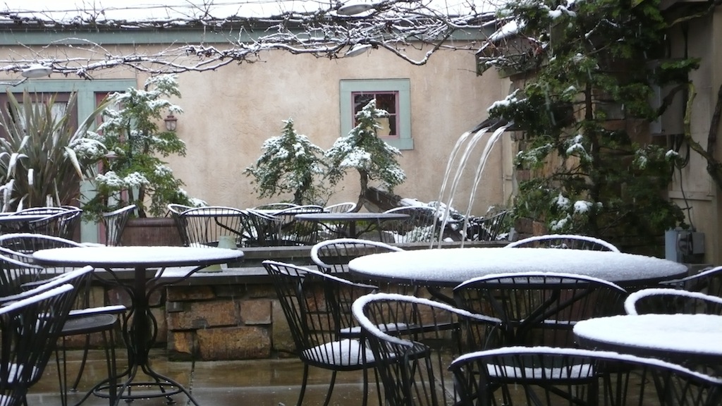 A late spring snow fell on the pergola outside Barking Frog. (Source: MRNY)
